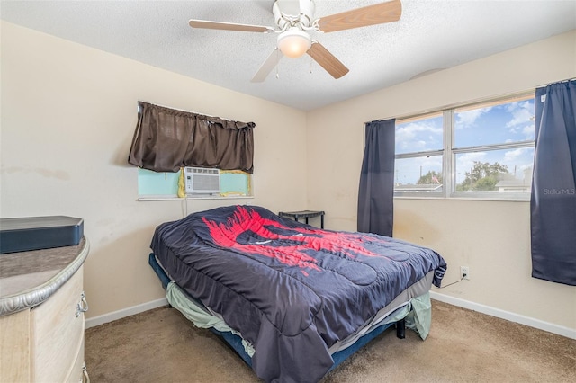 carpeted bedroom featuring ceiling fan, cooling unit, and a textured ceiling