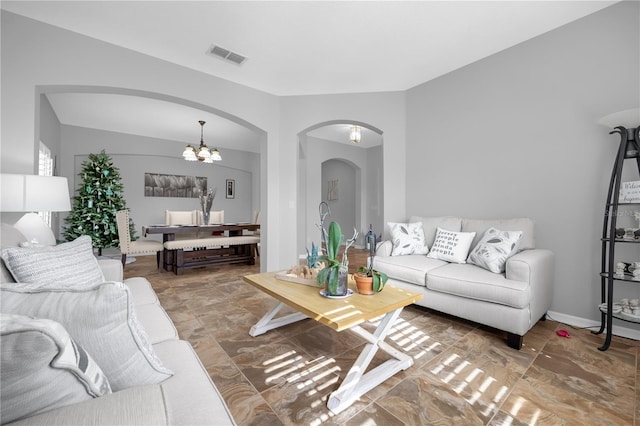 living room featuring an inviting chandelier