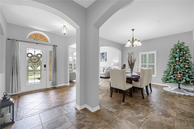 entrance foyer featuring a notable chandelier