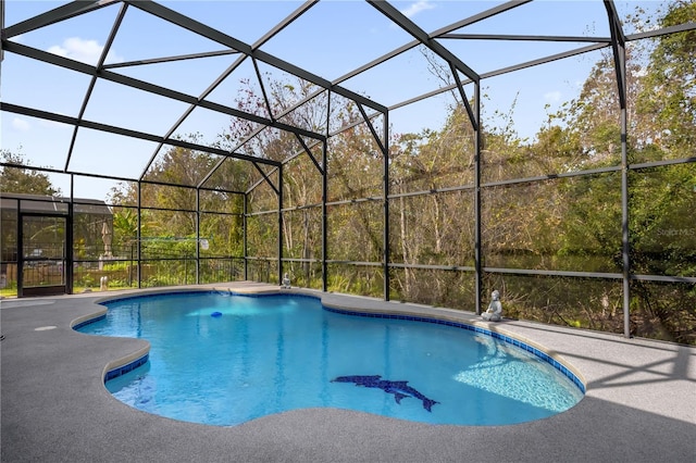 view of pool featuring a lanai and a patio area