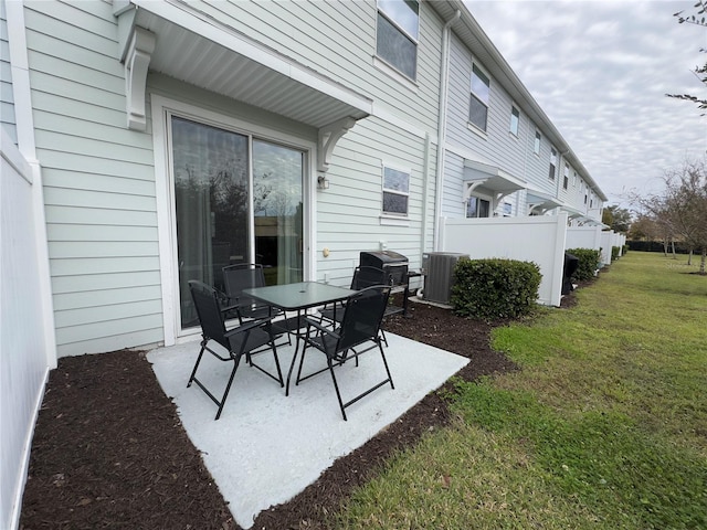 view of patio / terrace with cooling unit and area for grilling