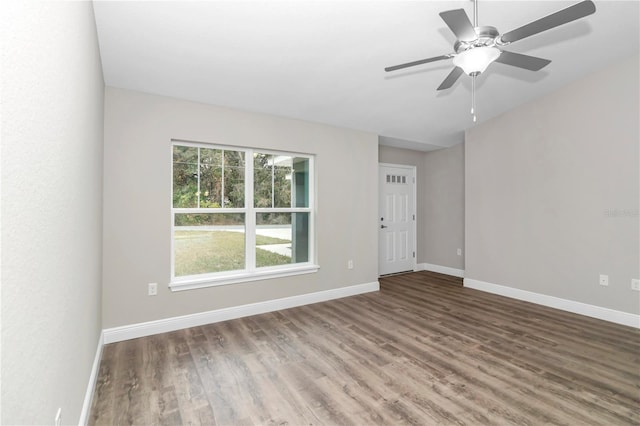 spare room with wood-type flooring and ceiling fan