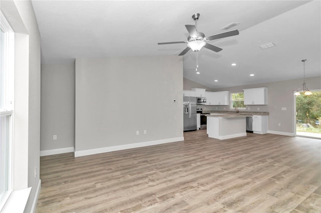 unfurnished living room with ceiling fan, light hardwood / wood-style flooring, and lofted ceiling