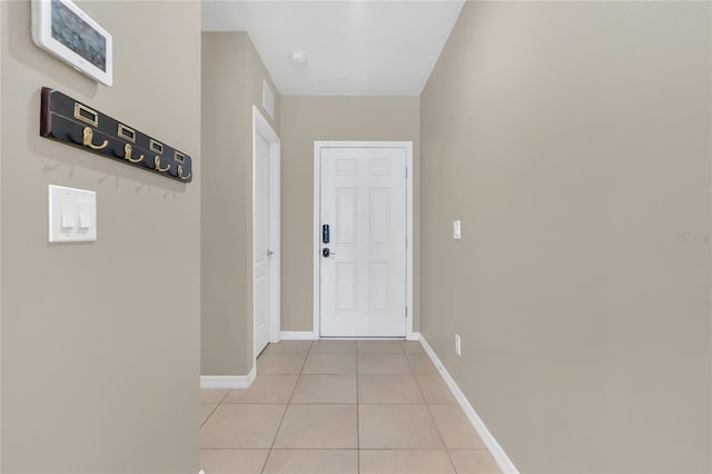 doorway featuring light tile patterned flooring