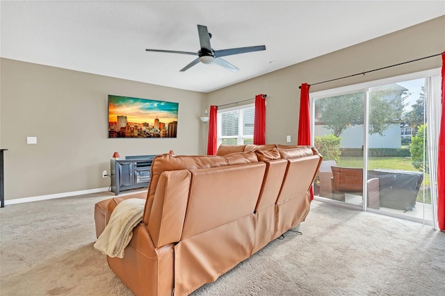 carpeted living room with ceiling fan