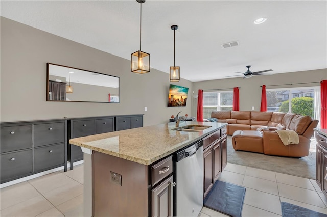 kitchen with ceiling fan, dishwasher, sink, pendant lighting, and a center island with sink