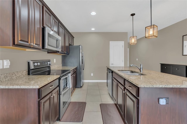 kitchen featuring dark brown cabinetry, sink, hanging light fixtures, light tile patterned floors, and appliances with stainless steel finishes