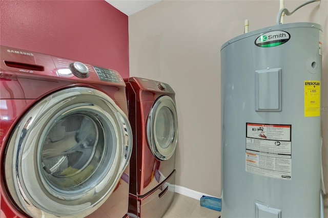 clothes washing area with separate washer and dryer, light tile patterned floors, and water heater