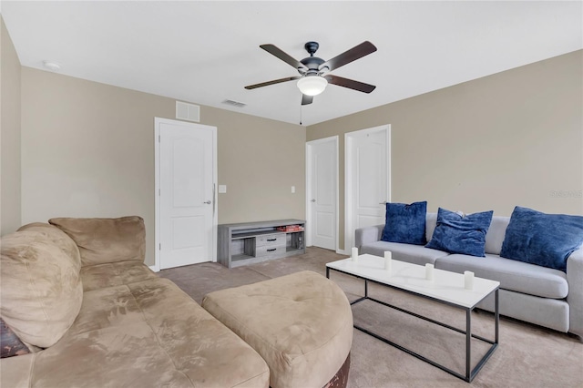 living room with light carpet and ceiling fan