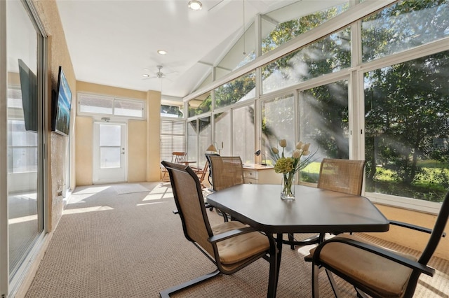 sunroom featuring ceiling fan and lofted ceiling