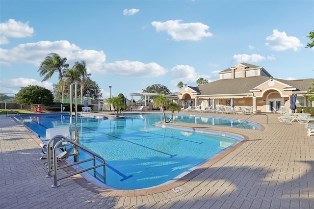 view of swimming pool with a patio area