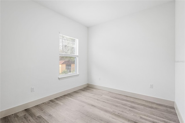 spare room featuring light hardwood / wood-style flooring