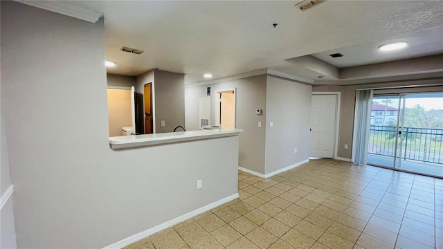 empty room featuring crown molding