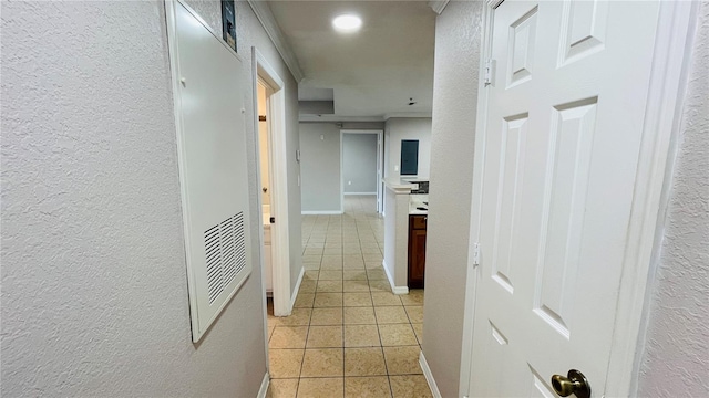 corridor with light tile patterned floors