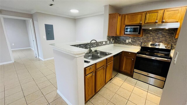 kitchen featuring light tile patterned floors, kitchen peninsula, backsplash, and appliances with stainless steel finishes