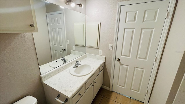 bathroom featuring tile patterned floors and vanity