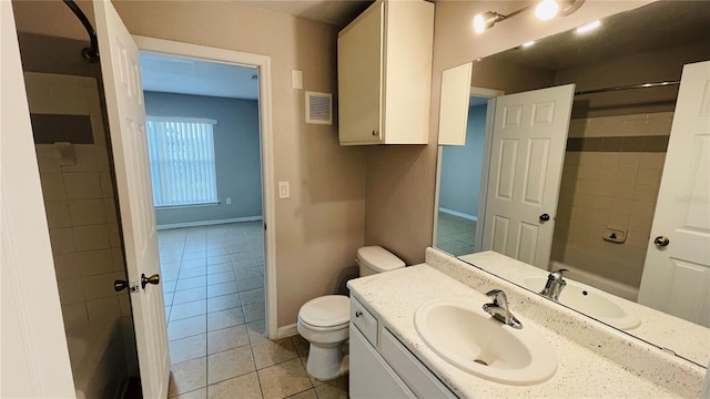 bathroom featuring tile patterned floors, vanity, and toilet