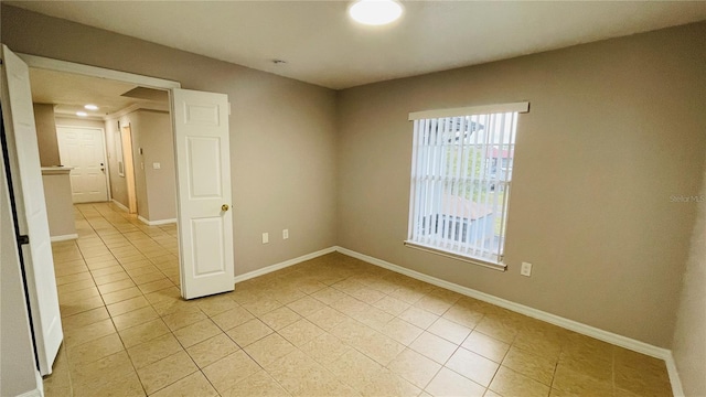 empty room with light tile patterned floors