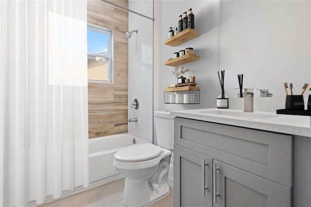 full bathroom with toilet, vanity, tile patterned floors, and tiled shower / bath combo