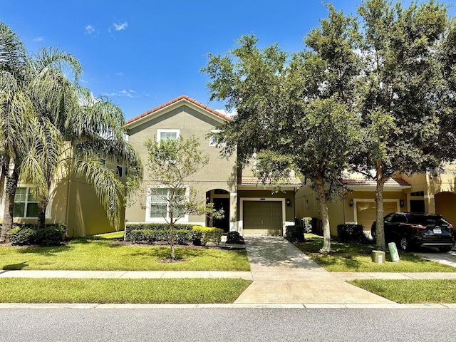 mediterranean / spanish-style home with a front lawn