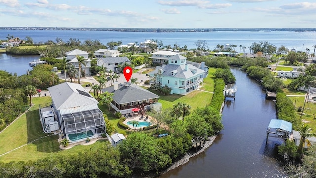 birds eye view of property with a water view