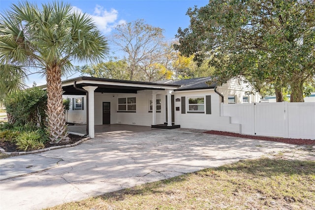 exterior space with a carport