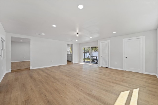 unfurnished living room with light hardwood / wood-style flooring