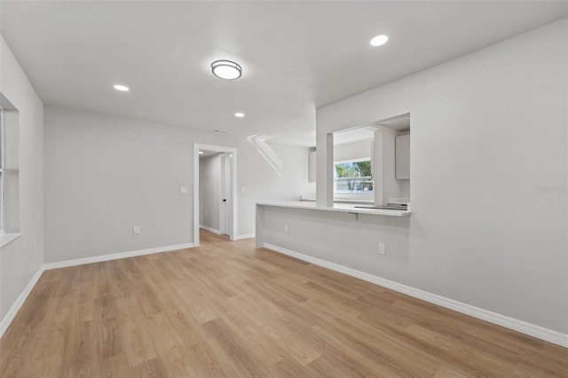 unfurnished living room with light wood-type flooring