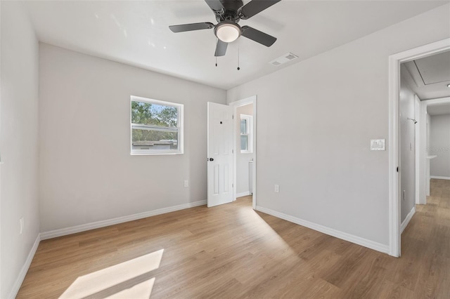 unfurnished room with light hardwood / wood-style flooring and ceiling fan