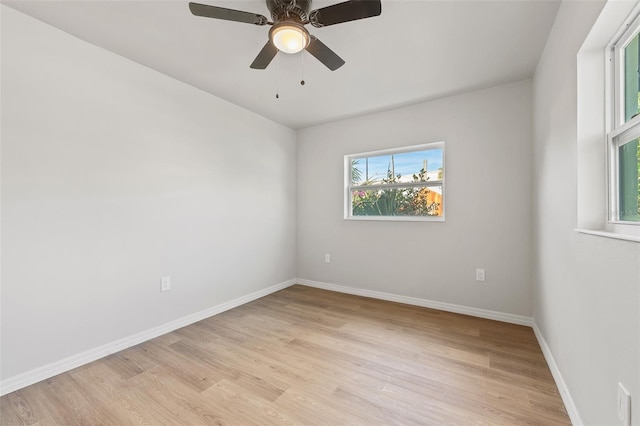 spare room featuring ceiling fan and light hardwood / wood-style flooring