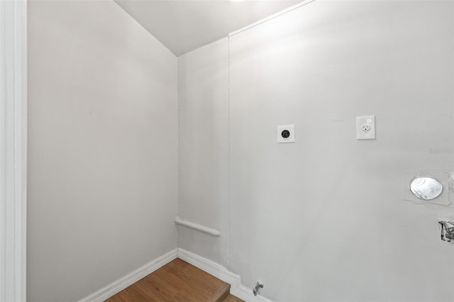 washroom featuring hookup for an electric dryer, wood-type flooring, and gas dryer hookup