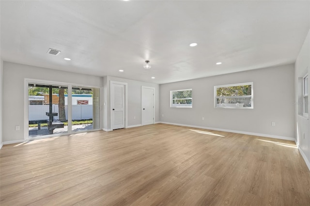 unfurnished living room featuring light hardwood / wood-style flooring