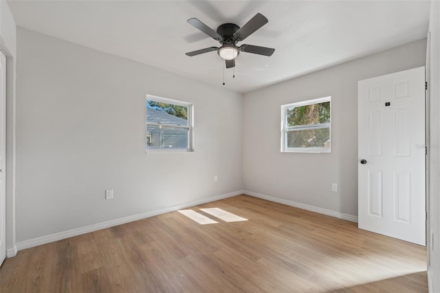 spare room featuring ceiling fan and light hardwood / wood-style flooring