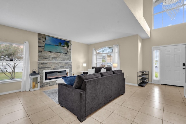 tiled living room featuring a fireplace and a wealth of natural light