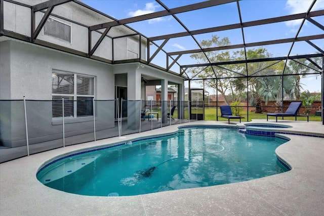 view of swimming pool with glass enclosure, an in ground hot tub, and a patio