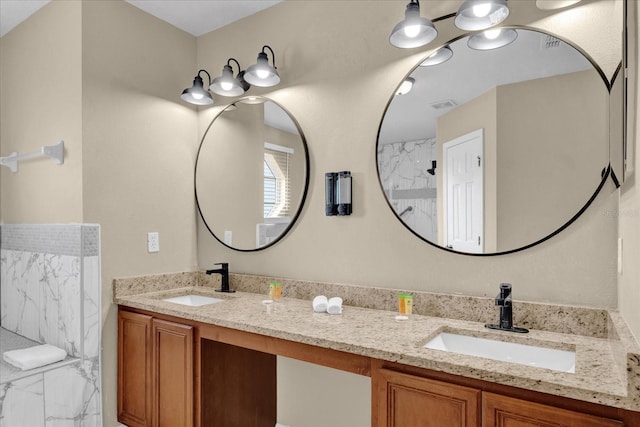 bathroom with vanity and a shower