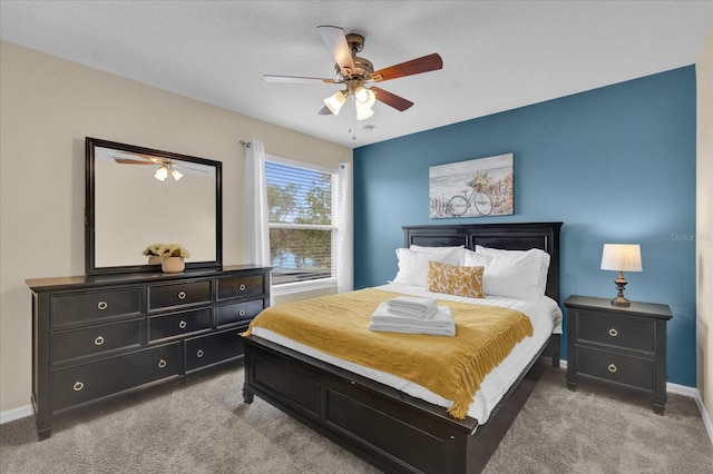 bedroom with light carpet and ceiling fan