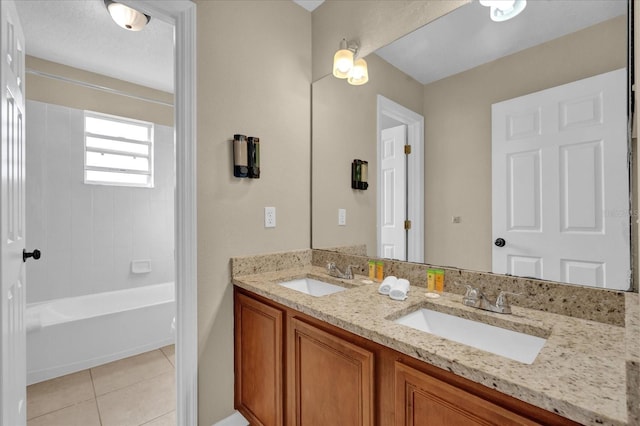 bathroom with tile patterned flooring, vanity, and shower / bath combination