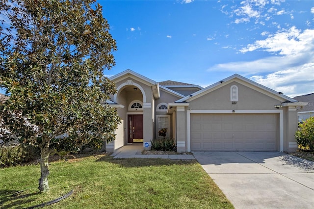 single story home with a garage and a front yard