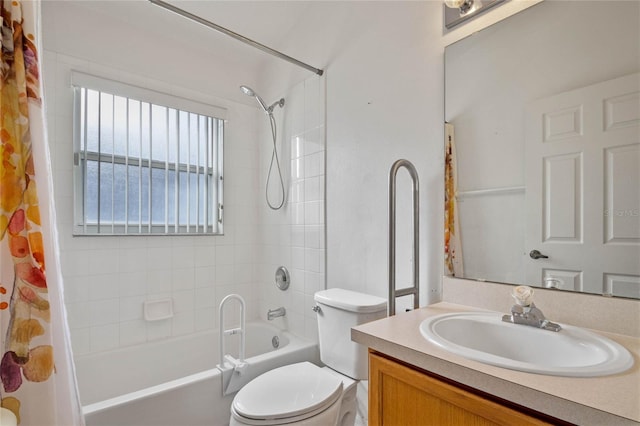 full bathroom with toilet, vanity, and shower / tub combo