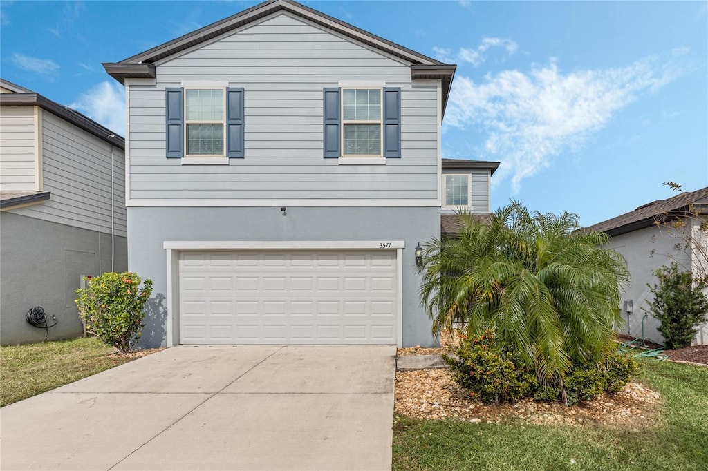 front of property with a garage