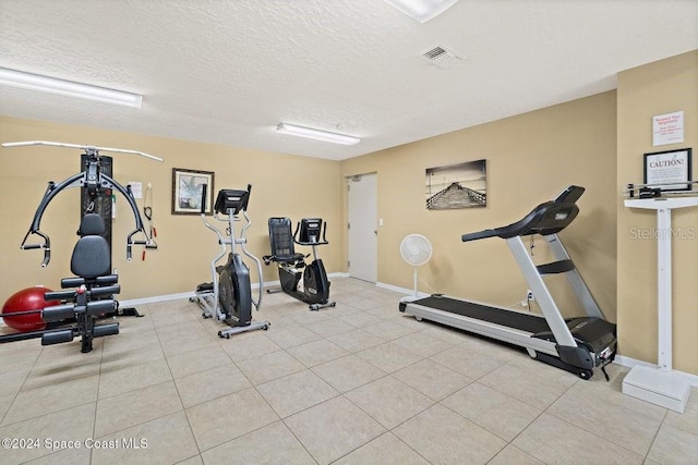 workout area with a textured ceiling