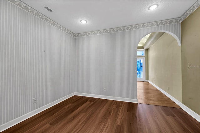 unfurnished room with hardwood / wood-style floors