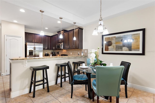 dining area with light tile patterned flooring