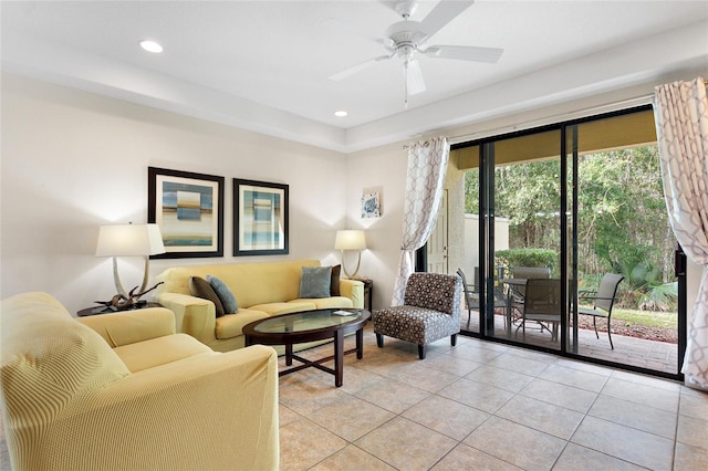 tiled living room with ceiling fan