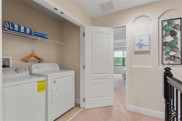 laundry room featuring washer and clothes dryer