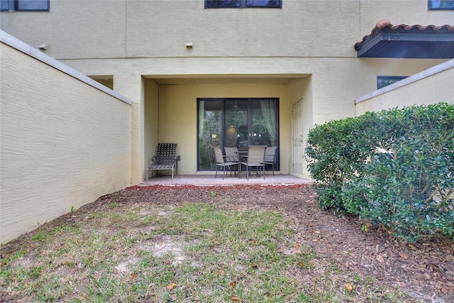 property entrance with a patio