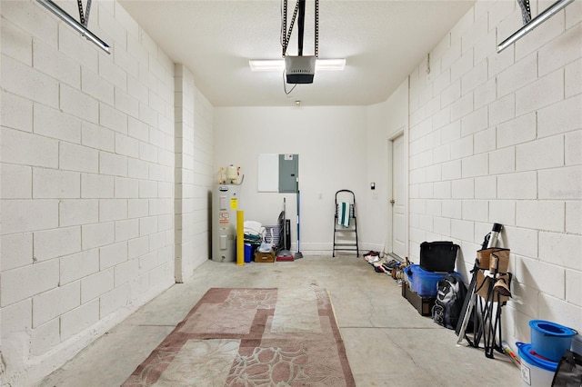 garage featuring electric water heater and a garage door opener