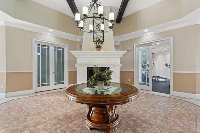 tiled entryway with beamed ceiling, french doors, ceiling fan with notable chandelier, and ornamental molding