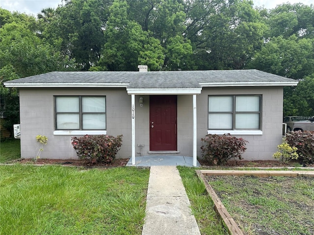 ranch-style home with a front yard